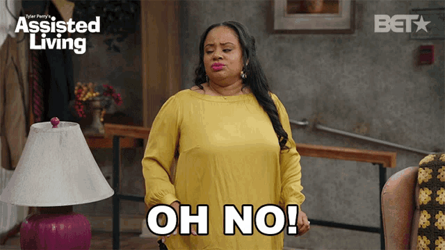 a woman in a yellow shirt says " oh no "