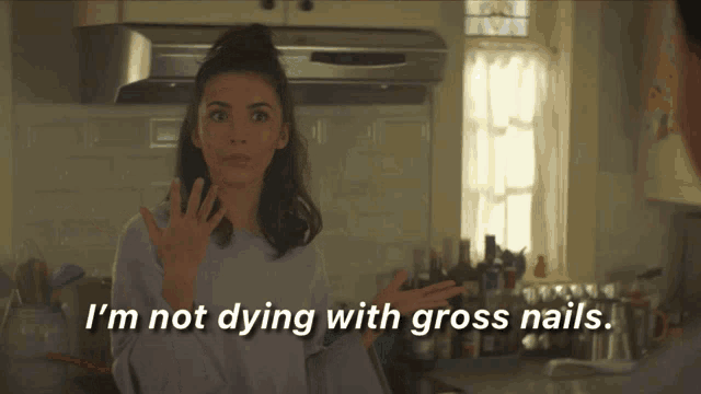 a woman in a purple sweater says i 'm not dying with gross nails