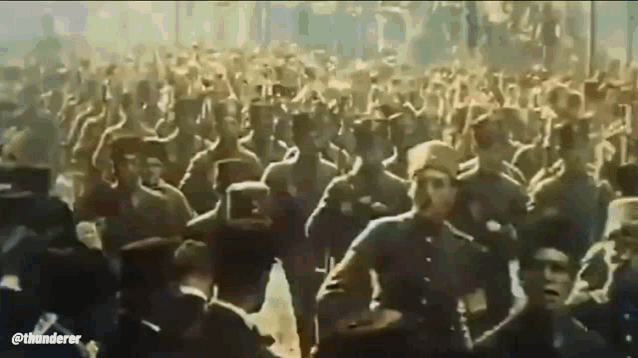 a large group of soldiers are marching in a military parade .