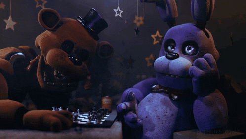 a brown teddy bear and a purple stuffed animal are playing chess