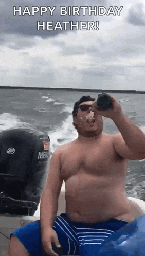 a shirtless man is sitting on a boat drinking from a can .