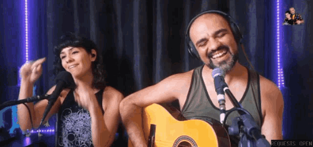 a man and a woman singing into microphones with requests open