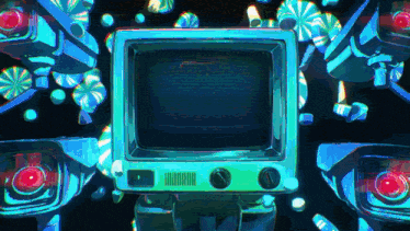 a television is surrounded by cameras and candy in a dark room