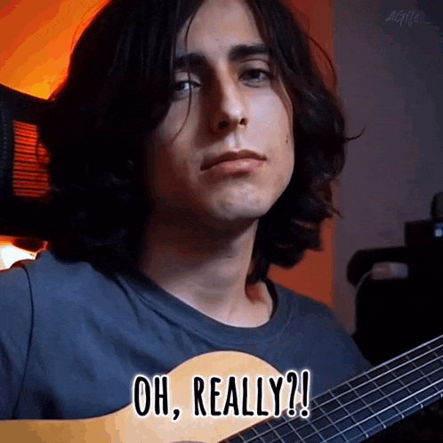 a young man is holding a guitar and saying oh really