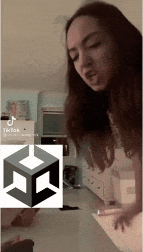 a woman is standing in front of a tiktok icon
