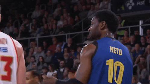 a basketball player wearing a blue jersey with the number 10