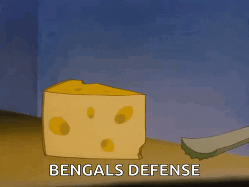 a cartoon of jerry looking out of a piece of cheese with the words bengals defense below it