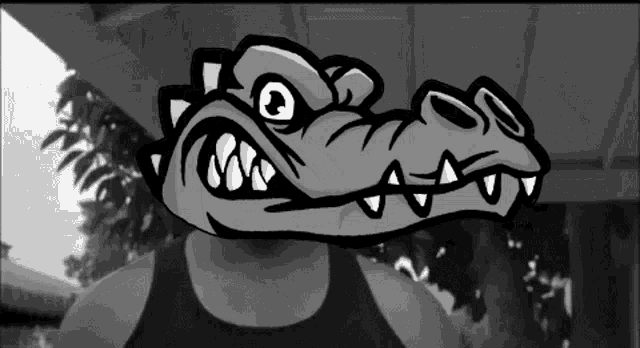 a black and white photo of a person with a cartoon crocodile head on their face