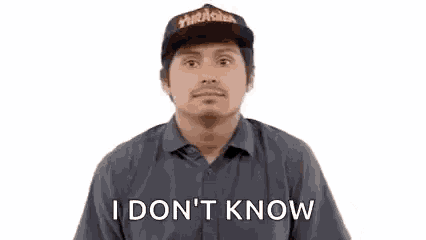a man wearing a hat and a shirt is shrugging his shoulders and saying `` i don 't know '' .