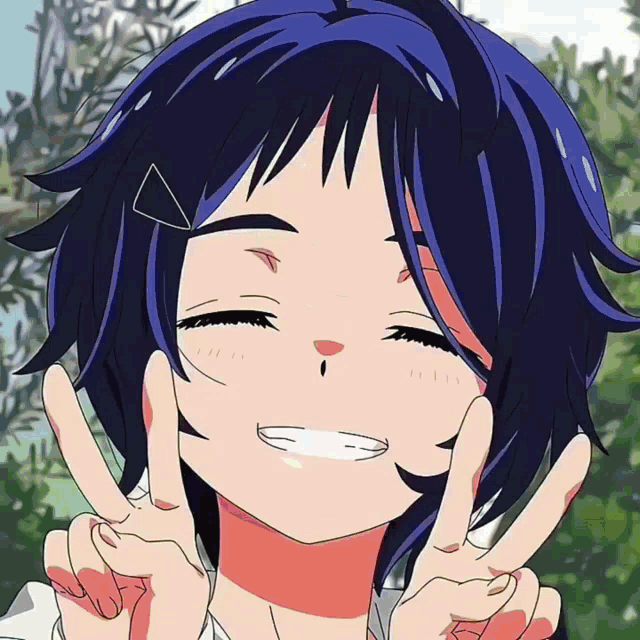 a girl with blue hair is smiling and giving a peace sign