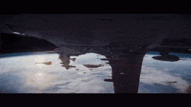 a space ship is flying over the earth in the space