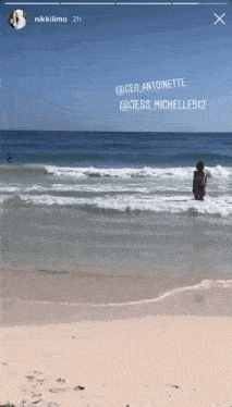 a woman in a bikini is standing in the ocean with the name jess on the bottom right