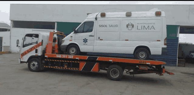 a white sisol salud ambulance is on a tow truck