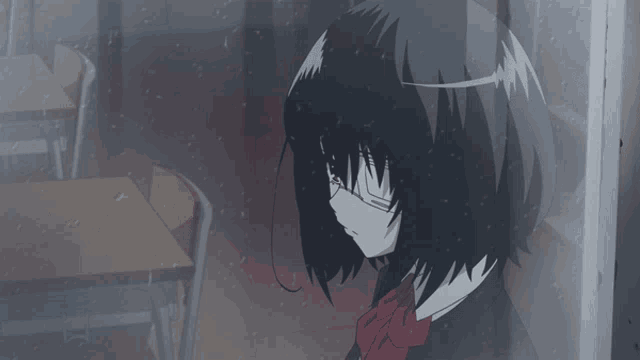 a girl with a mask on her face looks out a window