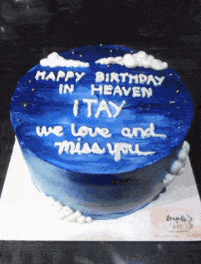 a blue cake that says happy birthday in heaven