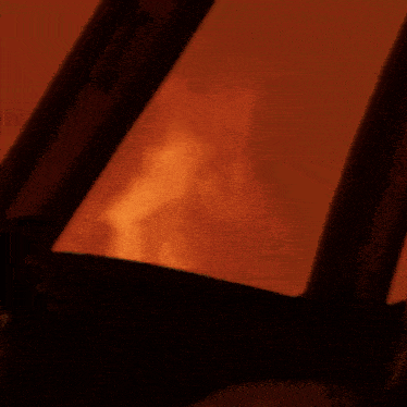 a close up of a fire through a window