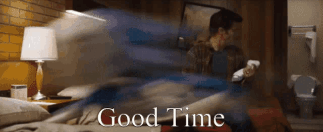 a blurred image of a man in a hotel room with the words " good time " below him