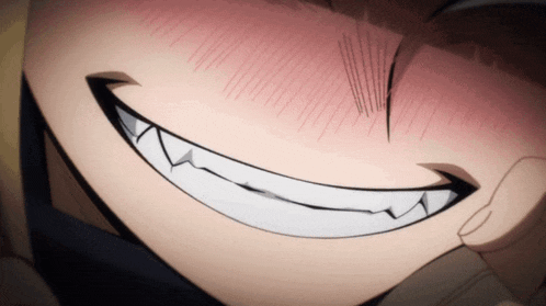 a close up of a person 's face with a large smile