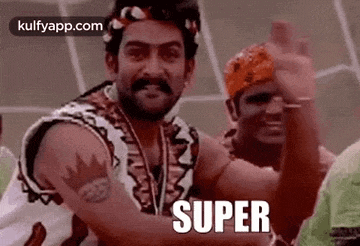 a man with a mustache and a medal around his neck is standing next to a group of people and says `` super '' .