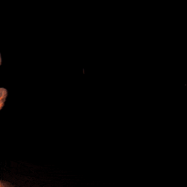 a black background with a lot of fire and smoke coming out of it