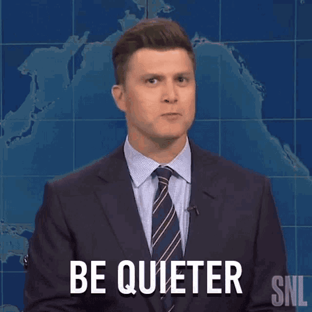 a man in a suit and tie says be quieter on snl