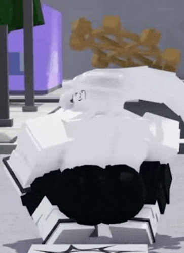 a person in a white shirt and black pants is standing on a white block .