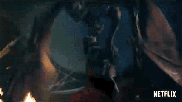 a netflix logo can be seen in the background of a video of a dragon flying through the air .