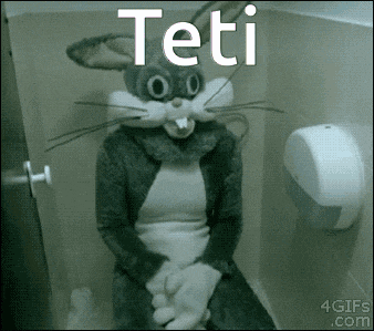 a person in a bunny costume is sitting on a toilet with the word teti above them