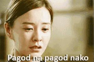 a close up of a woman 's face with the words pagod na pagod naka written on it .