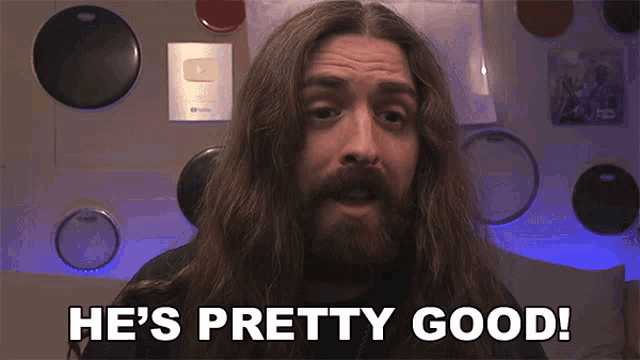 a man with long hair and beard says he 's pretty good