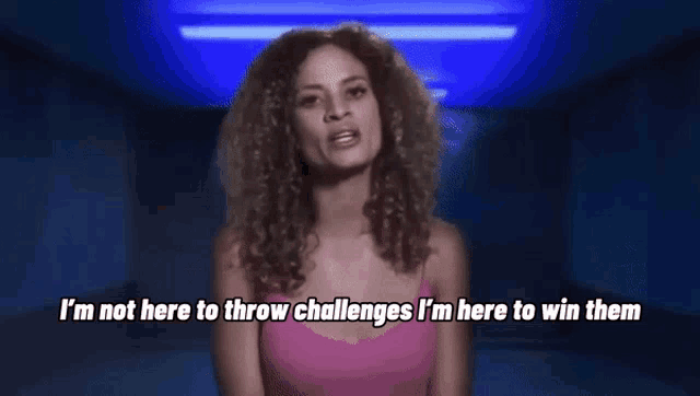 a woman with curly hair says i 'm not here to throw challenges i 'm here to win them .