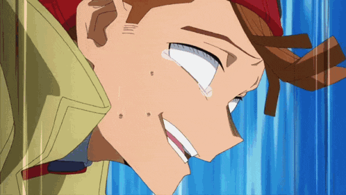 a close up of a person 's face with a tear coming out of his eye