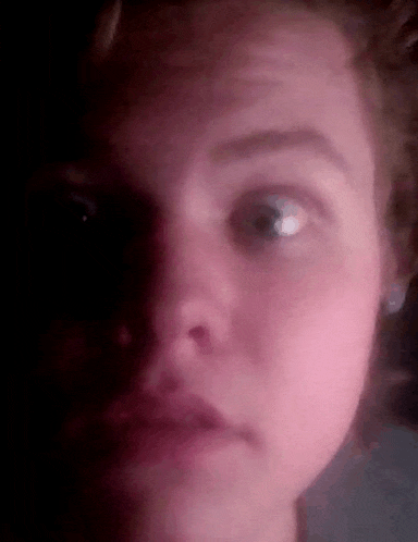 a close up of a person 's face with their eyes closed .
