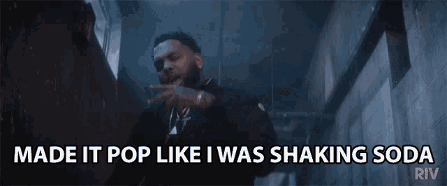 a man in a black jacket says made it pop like i was shaking soda