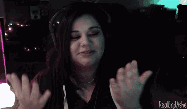 a woman is wearing headphones and says " my hands have touched worse "