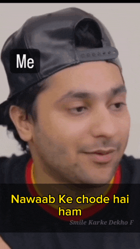 a man wearing a black hat and a black shirt with the words me and nawaab ke chode hai ham