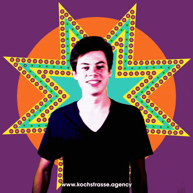 a man in a black shirt stands in front of a colorful star with the website www.kochstrasse.agency below him