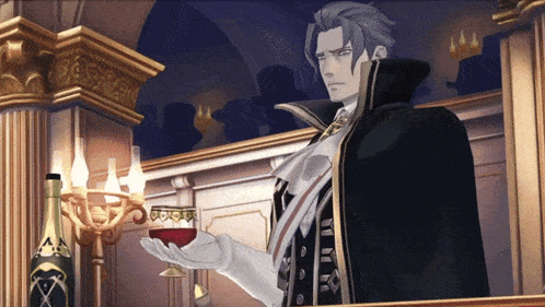 a man in a black cape holding a glass of wine