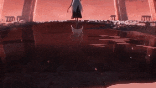 a woman in a white dress is standing next to a body of water with her reflection in it .