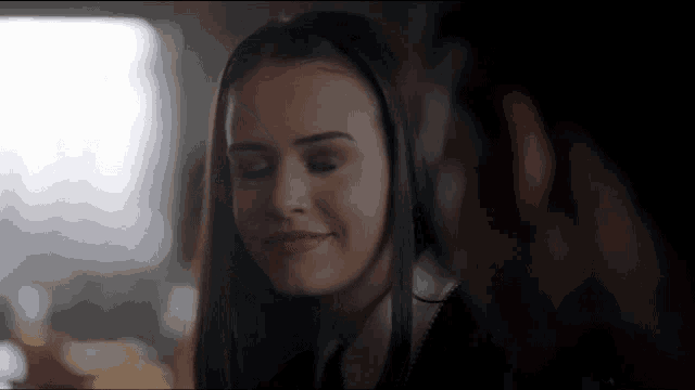 a close up of a woman 's face while looking at another woman 's face .