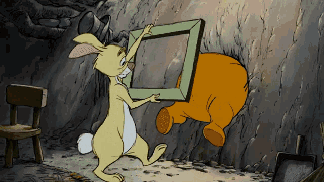 a cartoon of a rabbit holding a picture frame next to a chair