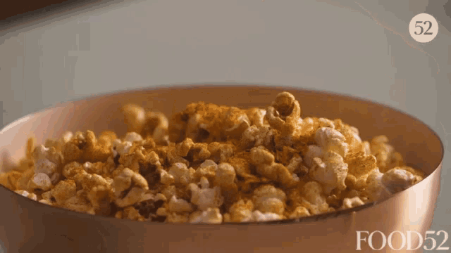 a bowl of popcorn with the number 52 on the top