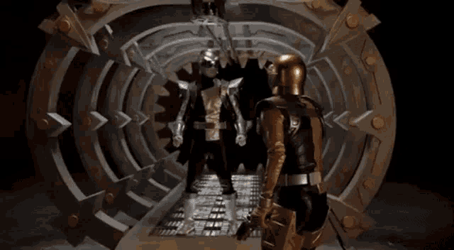 a group of superheros are standing in a dark room .