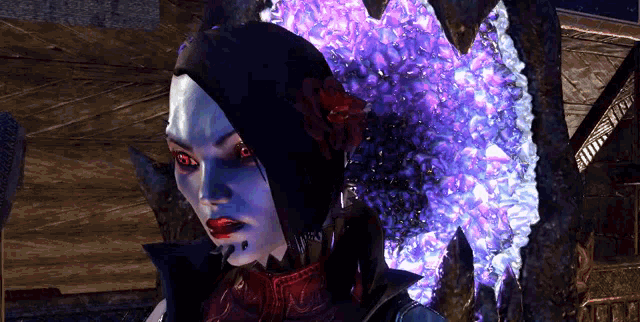 a woman with a flower in her hair is standing in front of a purple light .