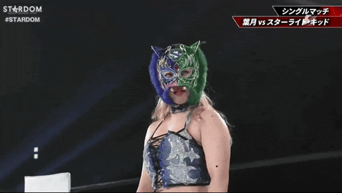a woman in a wrestling ring with a stardom logo in the background