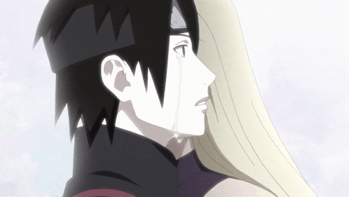 a man with a crown on his head is crying while holding a woman