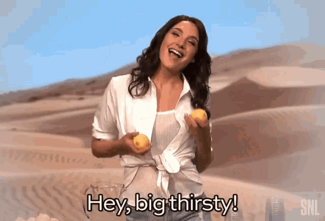 a woman is holding a pitcher of lemonade and saying hey big thirsty