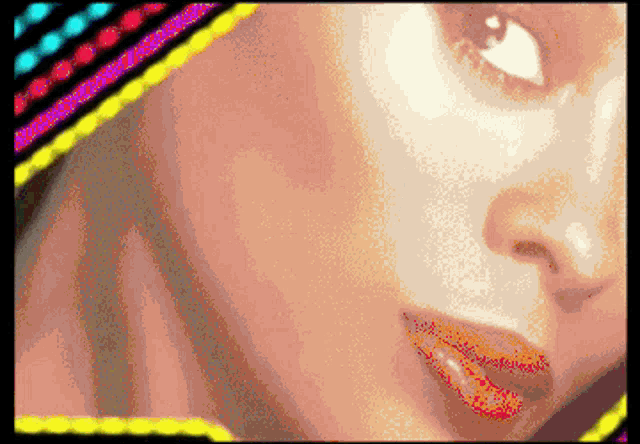 a close up of a woman 's face with a colorful border around it