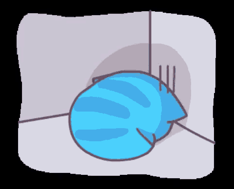 a blue cat is laying in a corner with its head on the wall