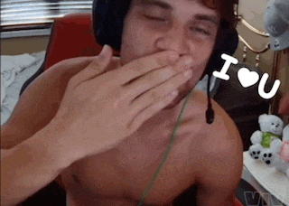 a shirtless man wearing headphones and covering his mouth with his hand with the words i love u behind him
